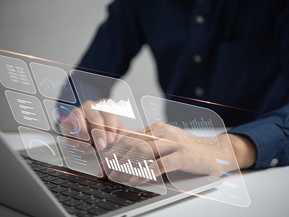 person using laptop overlaid with graphs and other measurement graphics